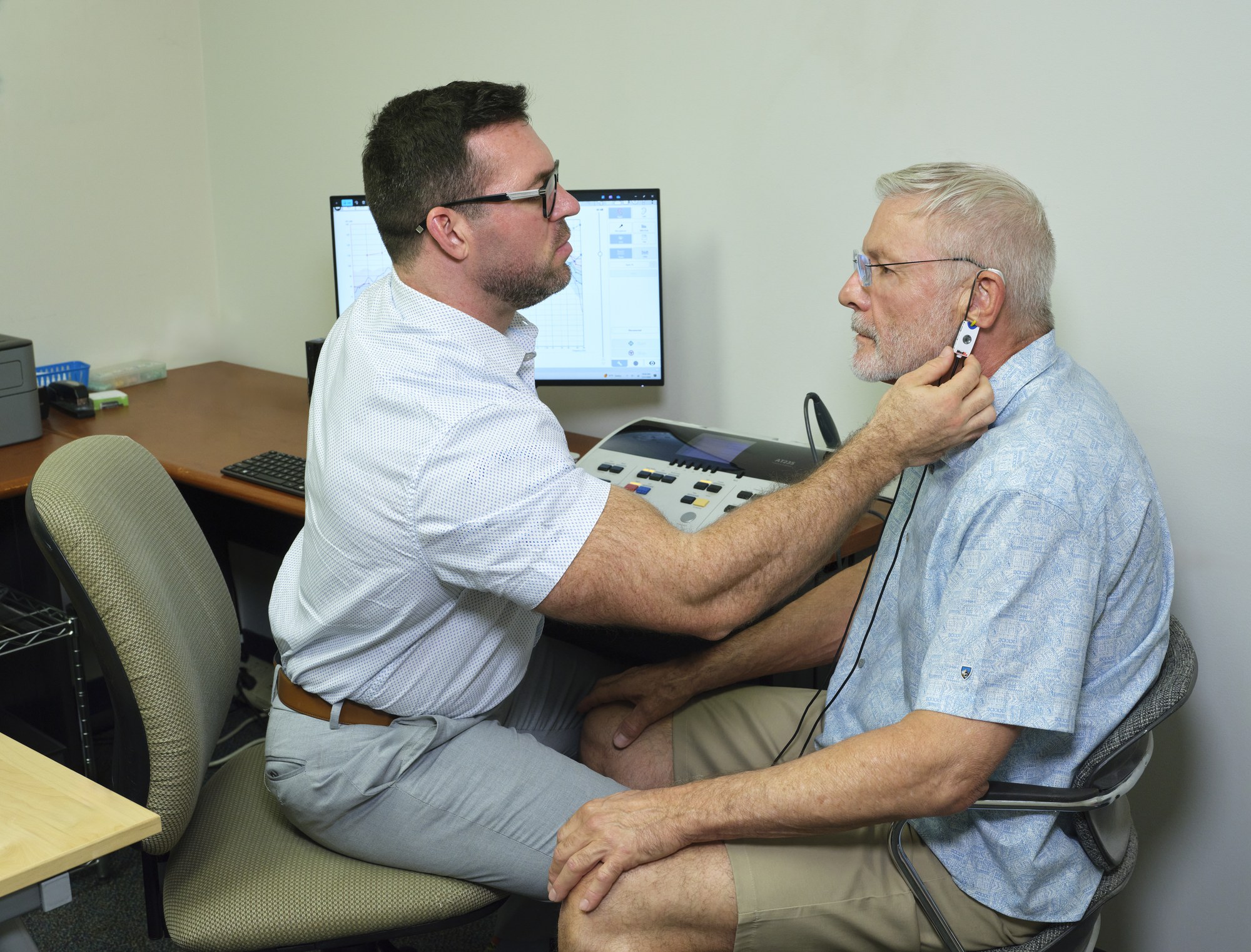 Andy Schirmer reviewing results with a patient